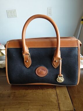 Dooney & Bourke Black with Tan Trim Pebbled Leather Satchel